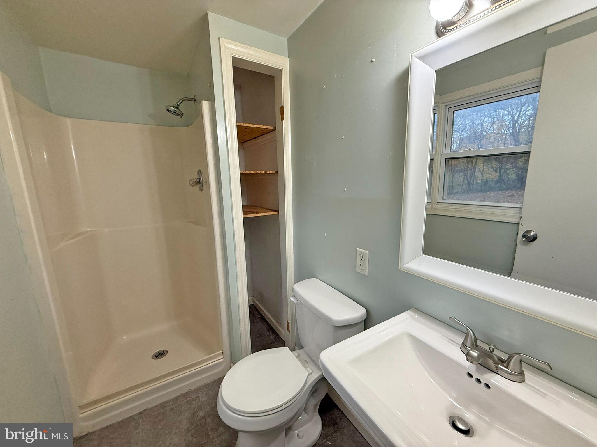 1316 Edgemont Road Harrisburg, PA 17109 - Photo 9 of 21 a white toilet sitting next to a bathroom sink