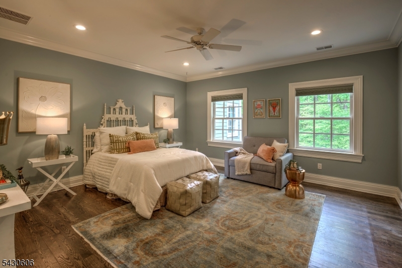 5 Burnett Road Mendham, NJ 07945 - Photo 28 of 50 a bedroom with a bed and wooden floor