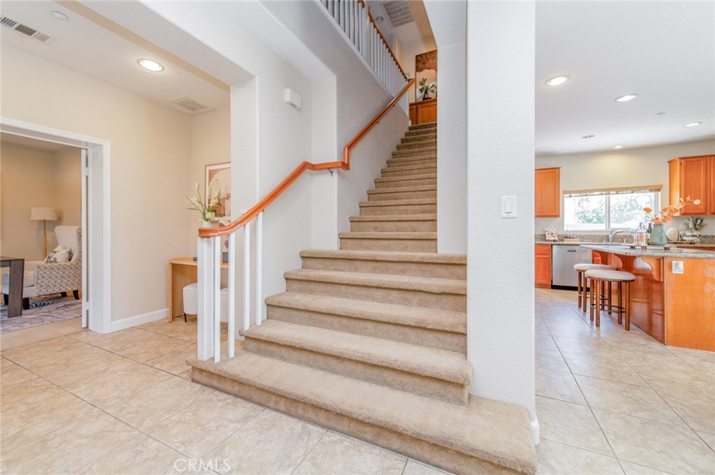 4947 Plumtree Court Riverside, CA 92504 - Photo 8 of 46 Make your way upstairs via the extra-wide staircase