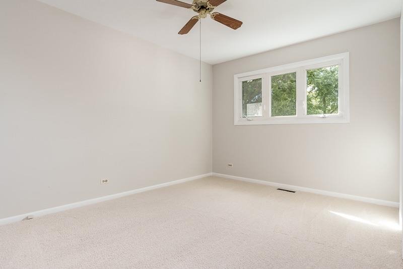 7924 Westview Lane Woodridge, IL 60517 - Photo 20 of 40 an empty room with a window and a fan
