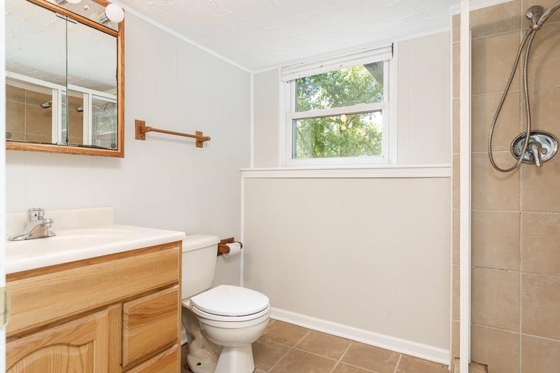 7924 Westview Lane Woodridge, IL 60517 - Photo 35 of 40 a bathroom with a sink toilet and a window