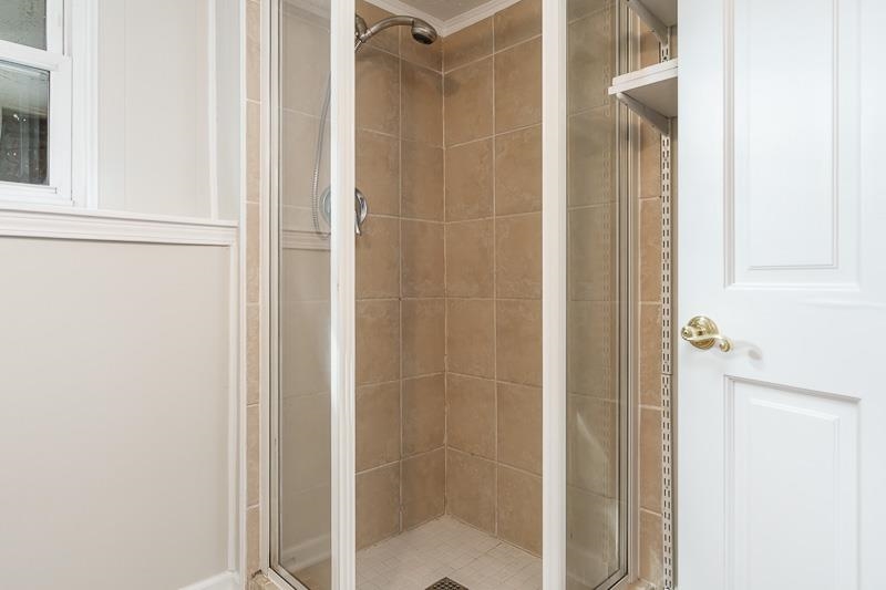 7924 Westview Lane Woodridge, IL 60517 - Photo 36 of 40 a bathroom with a glass shower door