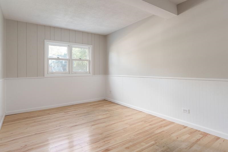 7924 Westview Lane Woodridge, IL 60517 - Photo 40 of 40 an empty room with wooden floor and windows