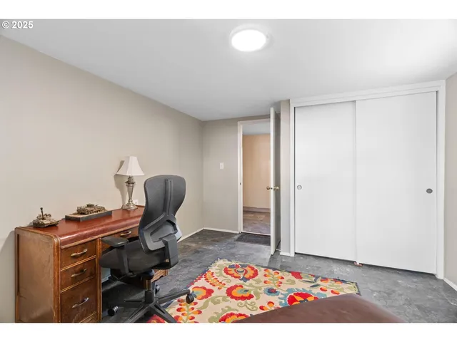 a living room with furniture and a rug