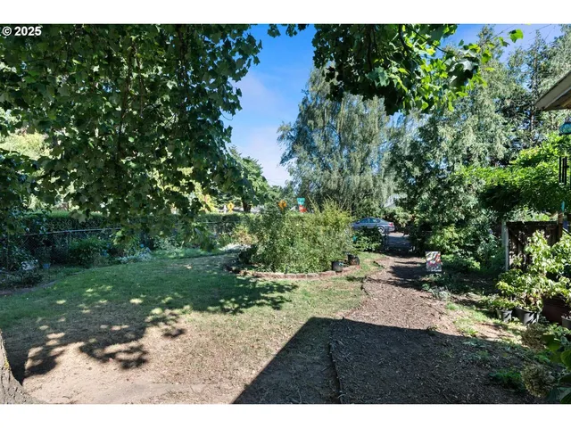 a backyard of a house with a yard and outdoor seating