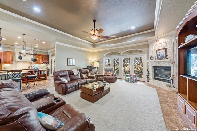 a dining room with a table chairs and kitchen view