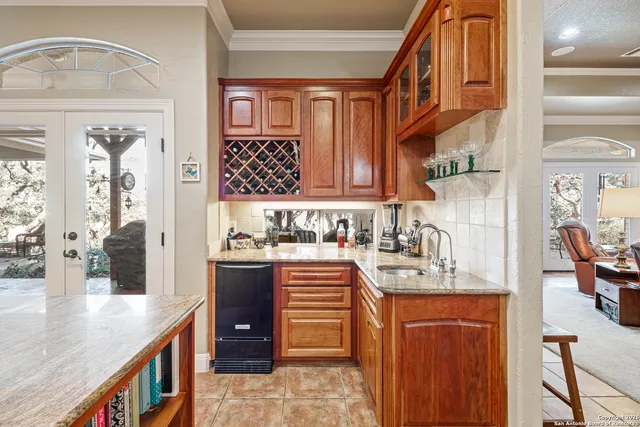 a view of a dining room with furniture and a window