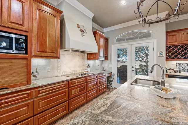 a bathroom with a granite countertop sink mirror vanity and toilet