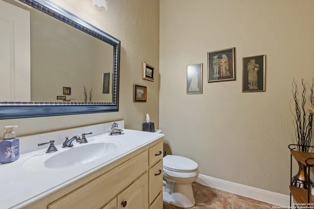 a kitchen with a stove top oven sink and cabinets