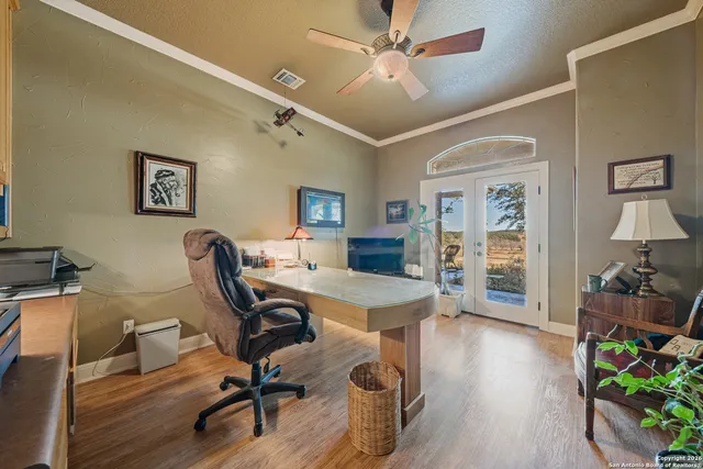 a kitchen with cabinets a sink and white appliances
