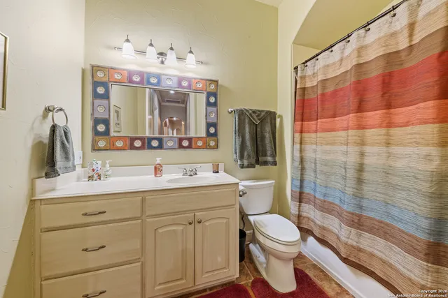 a view of a building with a table and chairs