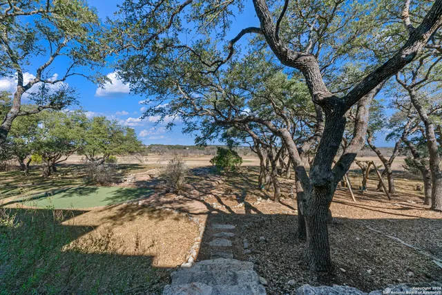 an aerial view of residential house with outdoor space