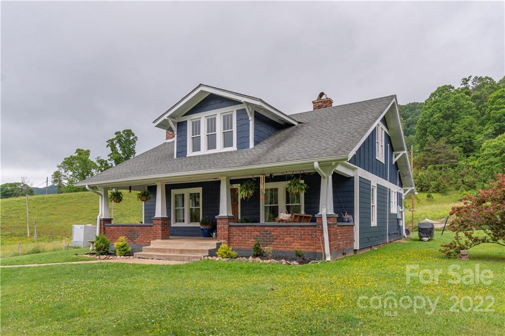 3215 Beaverdam Road Canton, NC 28716 - Photo 1 of 30 a front view of a house with a yard