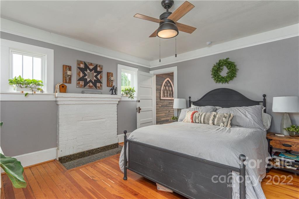 3215 Beaverdam Road Canton, NC 28716 - Photo 15 of 30 a bedroom with a bed and a chandelier