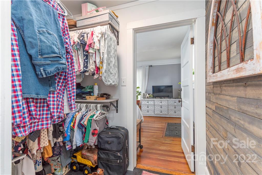 3215 Beaverdam Road Canton, NC 28716 - Photo 17 of 30 a view of walk in closet with clothes