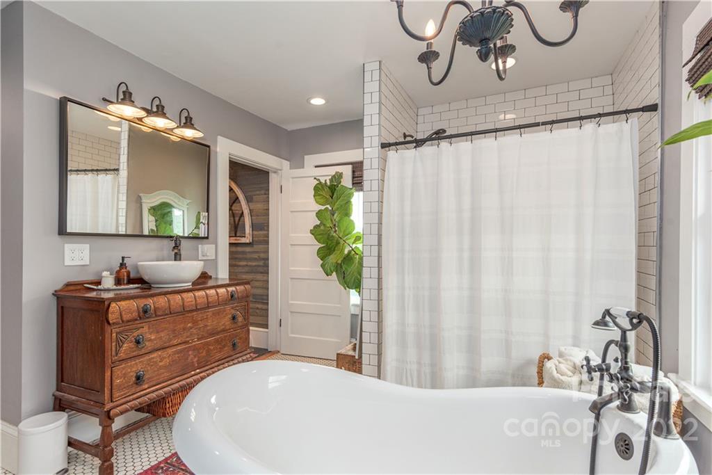 3215 Beaverdam Road Canton, NC 28716 - Photo 18 of 30 a bathroom with a bathtub and a sink