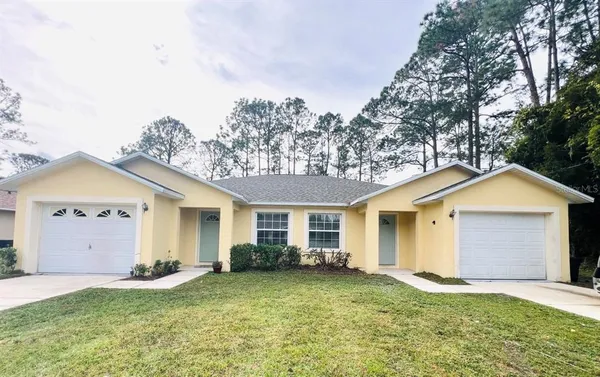 front view of a house and a yard