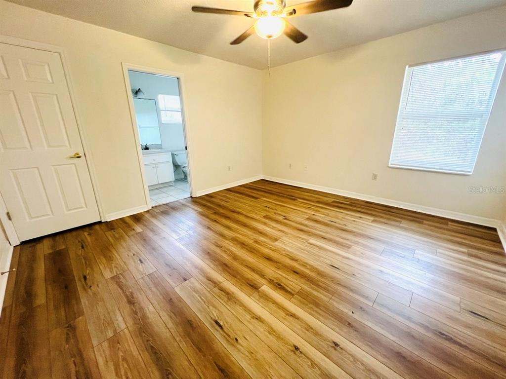 15 Bunker Knolls Lane, Unit B Palm Coast, FL 32137 - Photo 5 of 11 wooden floor in an empty room