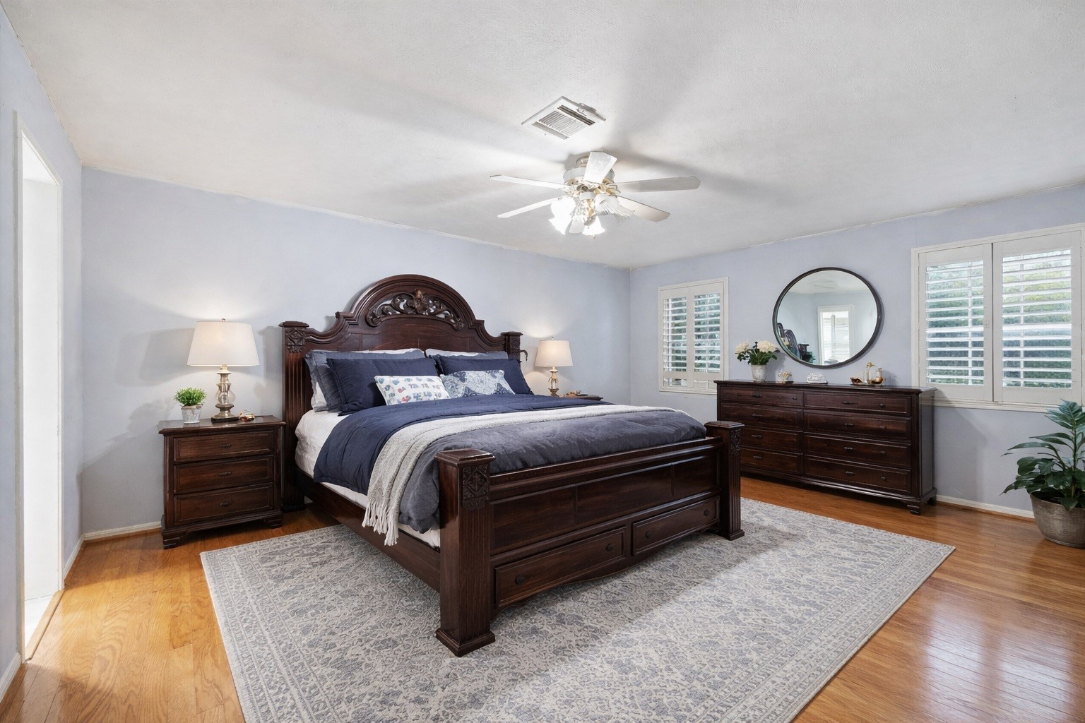 17814 Theiss Mail Rte Road Spring, TX 77379 - Photo 10 of 24 a bedroom with a bed and a chandelier