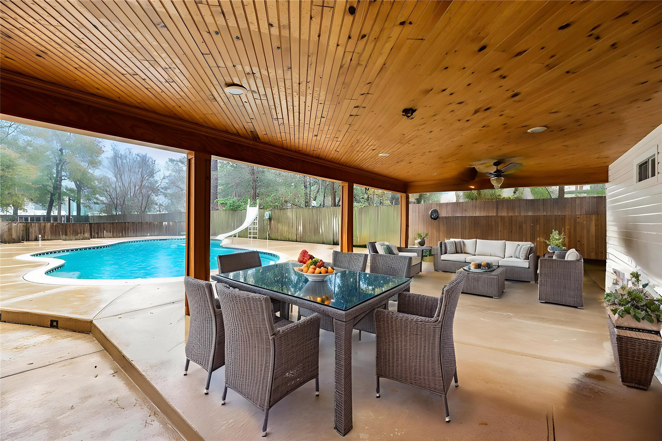 17814 Theiss Mail Rte Road Spring, TX 77379 - Photo 17 of 24 a dining room with furniture and a backyard