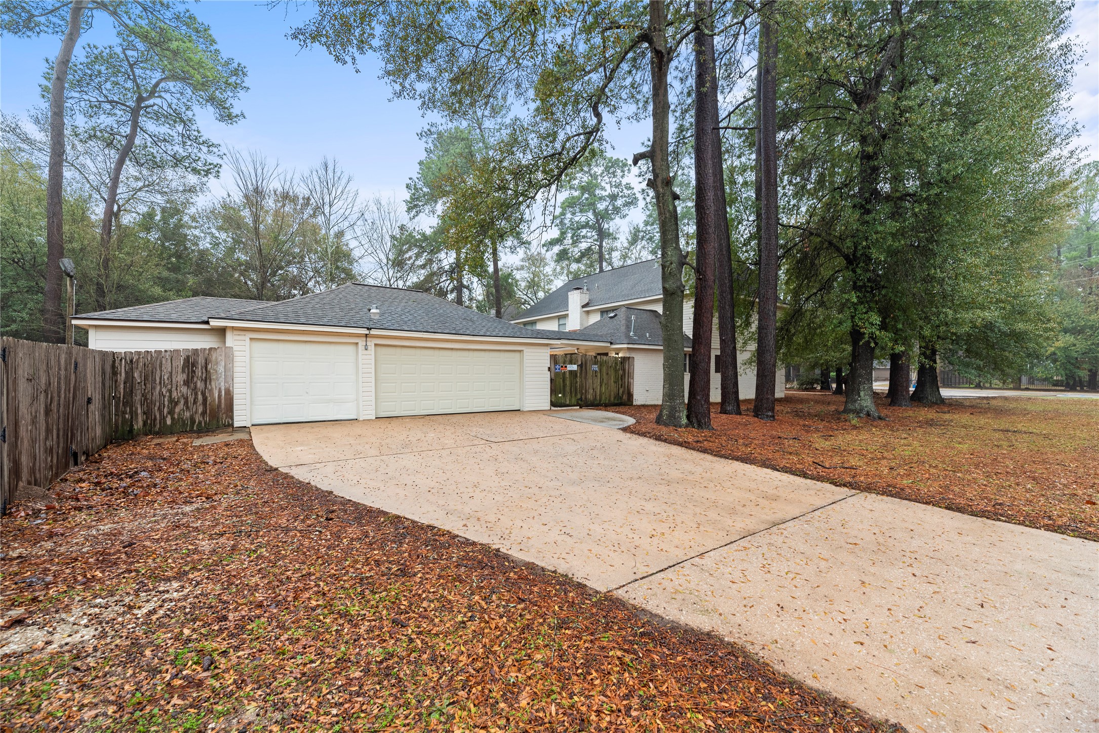17814 Theiss Mail Rte Road Spring, TX 77379 - Photo 20 of 24 a white house that has tree in front of it