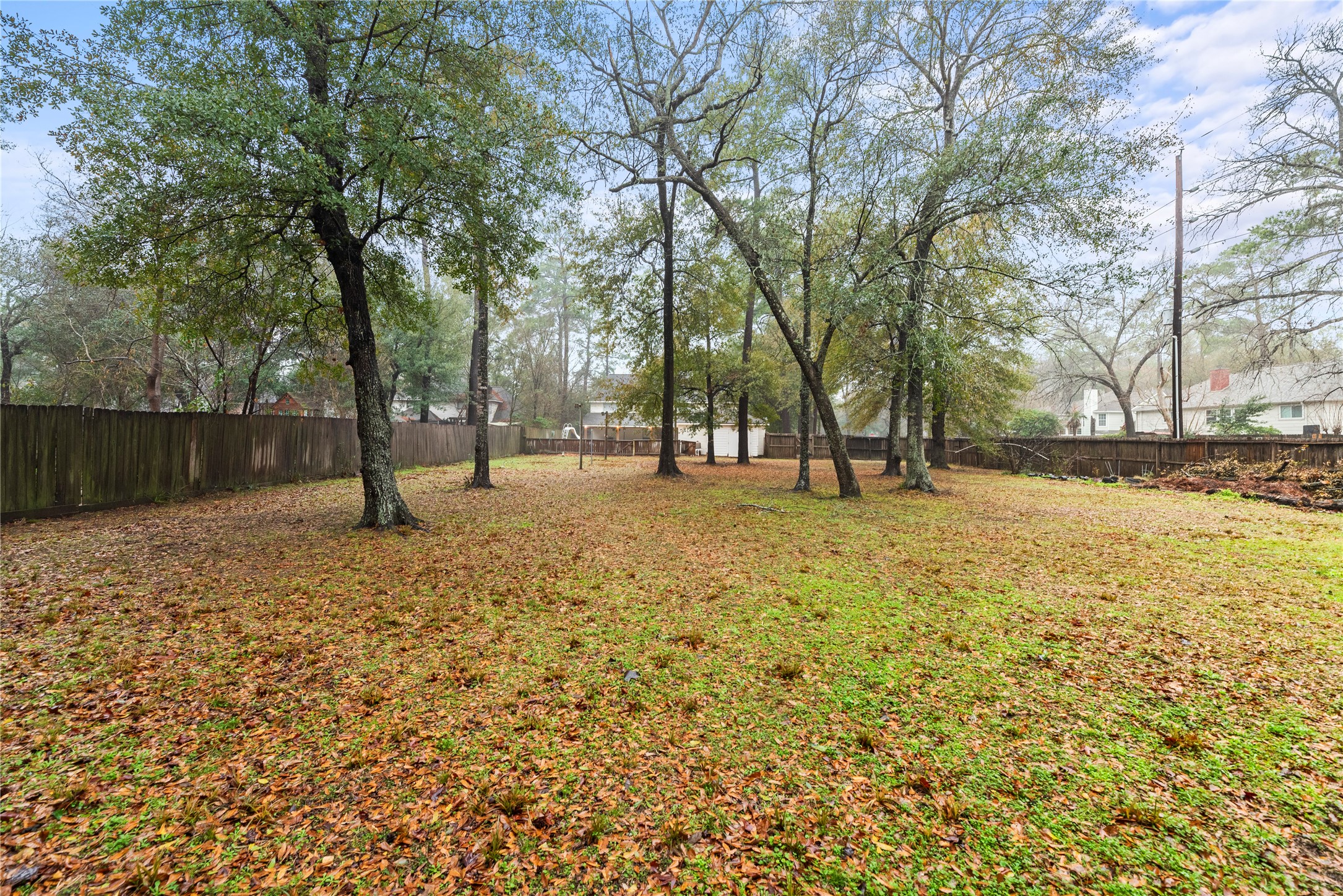17814 Theiss Mail Rte Road Spring, TX 77379 - Photo 21 of 24 a view of outdoor space with deck and trees