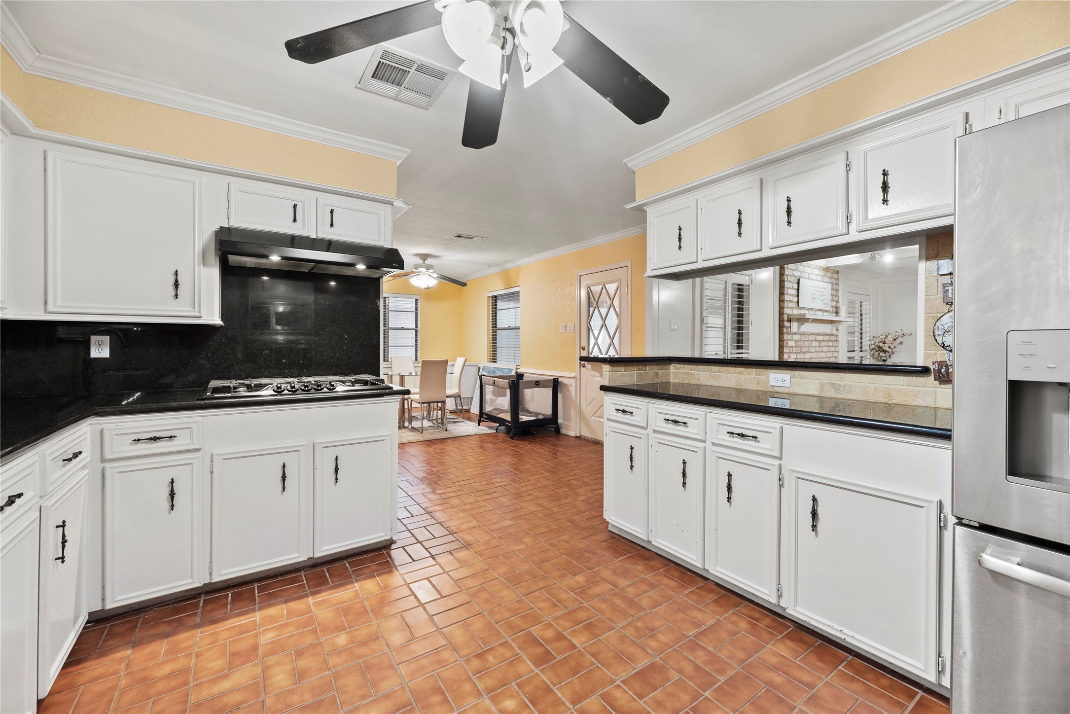 17814 Theiss Mail Rte Road Spring, TX 77379 - Photo 8 of 24 a kitchen with stainless steel appliances granite countertop a stove cabinets and microwave