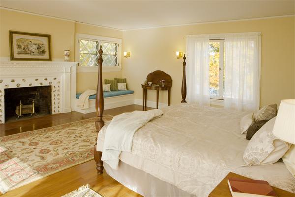 7 Norton's Point Road Manchester, MA 01944 - Photo 13 of 29 a bedroom with a bed and a fireplace