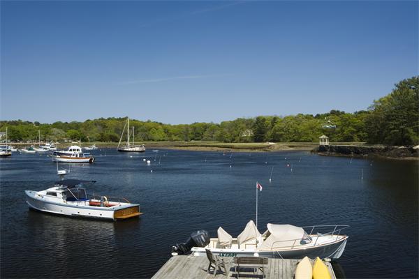 7 Norton's Point Road Manchester, MA 01944 - Photo 26 of 29 a view of a lake with a table and chairs