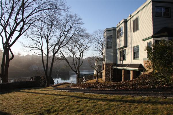 7 Norton's Point Road Manchester, MA 01944 - Photo 27 of 29 a view of a brick building next to a yard