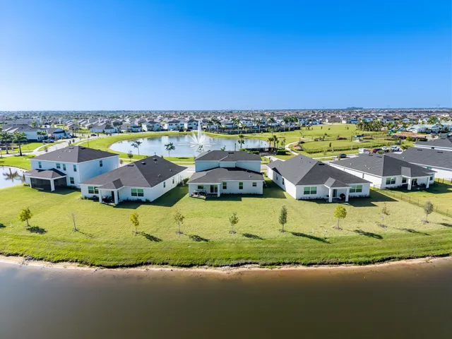 an aerial view of a house with a swimming pool