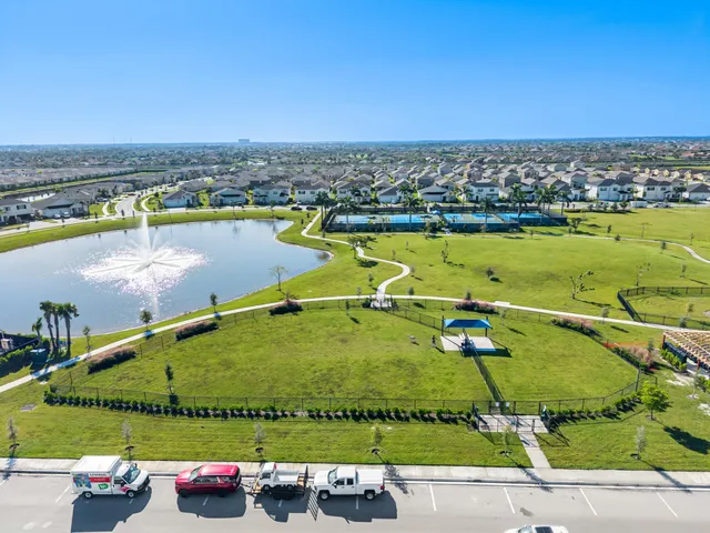 an aerial view of a residential houses with outdoor space