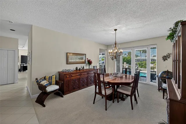 a kitchen with stainless steel appliances granite countertop a refrigerator a sink a stove and oven