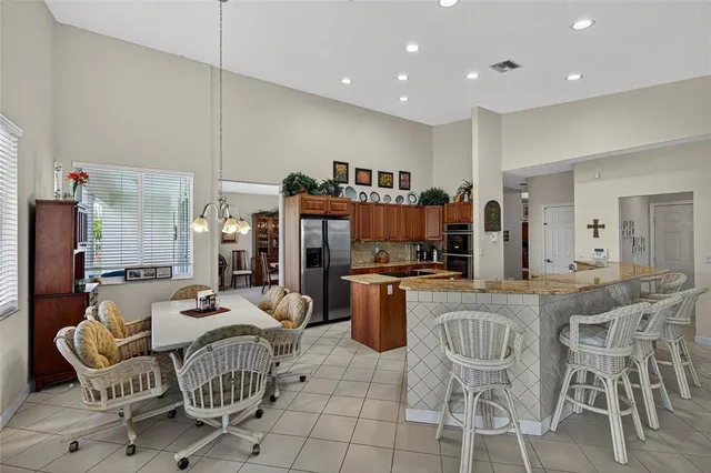 a spacious bedroom with a bed and a view of en suite bathroom