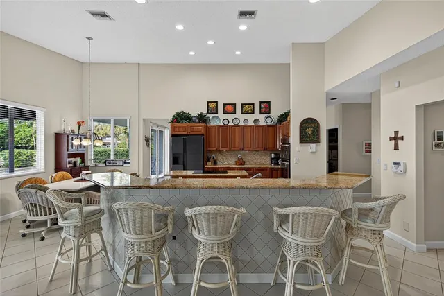 a spacious bedroom with a large bed and a wooden floor