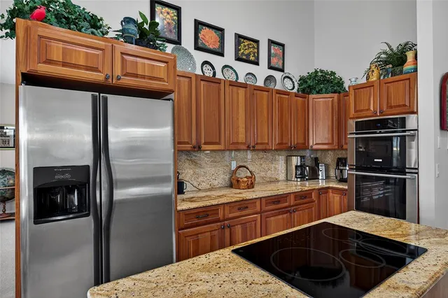 a bedroom with furniture and a large window