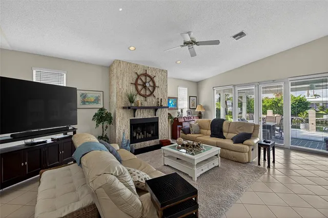 a bedroom with furniture and a large window