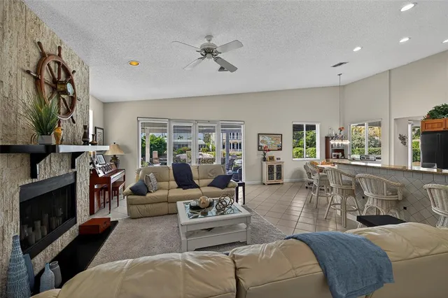 a bedroom with a bed and dresser with mirror