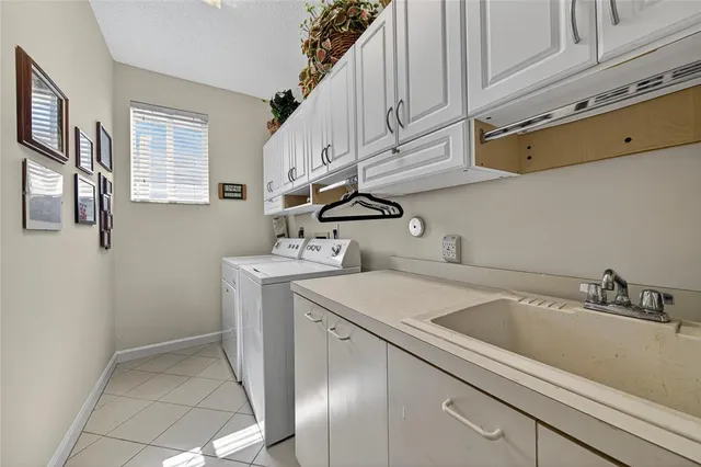 a bedroom with a large bed and a dresser