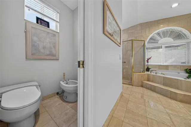 a living room with furniture a large window and a table