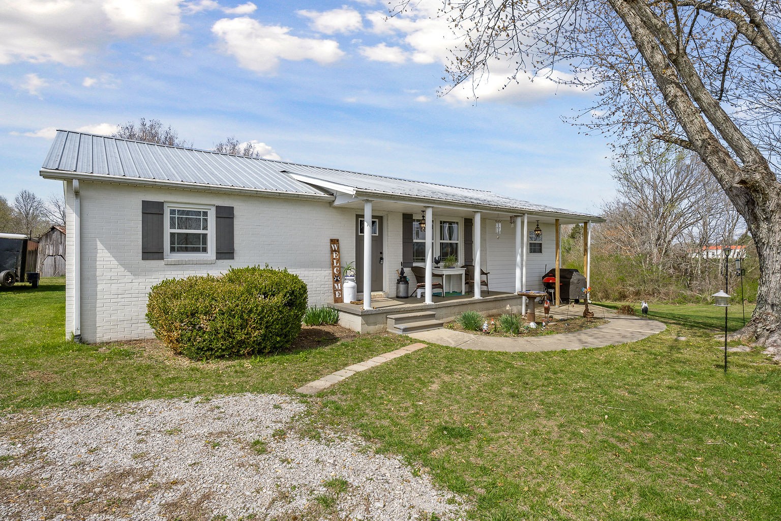 9025 Austin Bottom Road Baxter, TN 38544 - Photo 2 of 35 a view of a house with backyard and sitting area