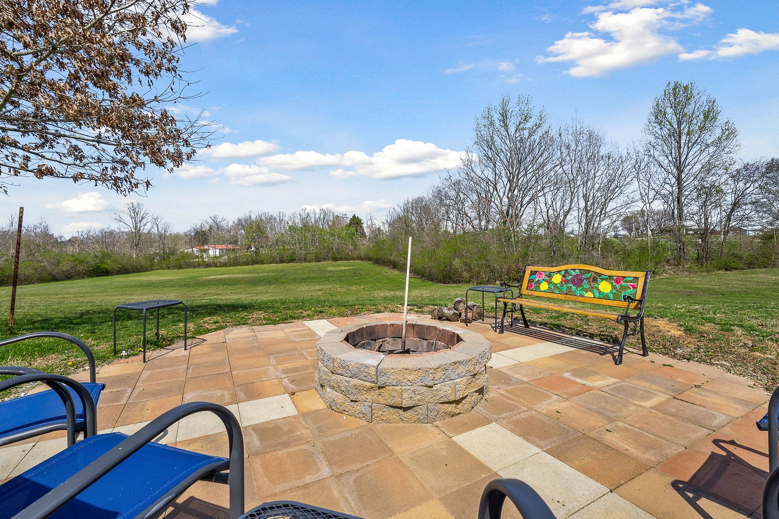 9025 Austin Bottom Road Baxter, TN 38544 - Photo 25 of 35 a backyard of a house with table and chairs