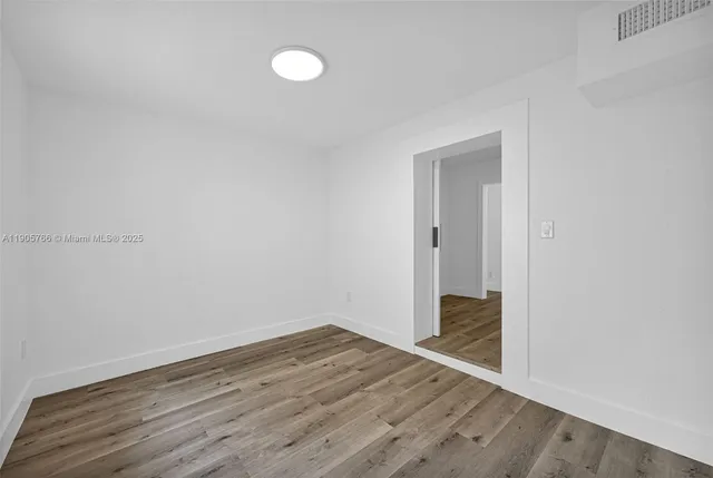 a bathroom with a toilet sink and shower