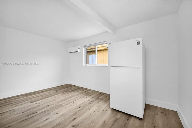 a view of a house with a big yard and large trees