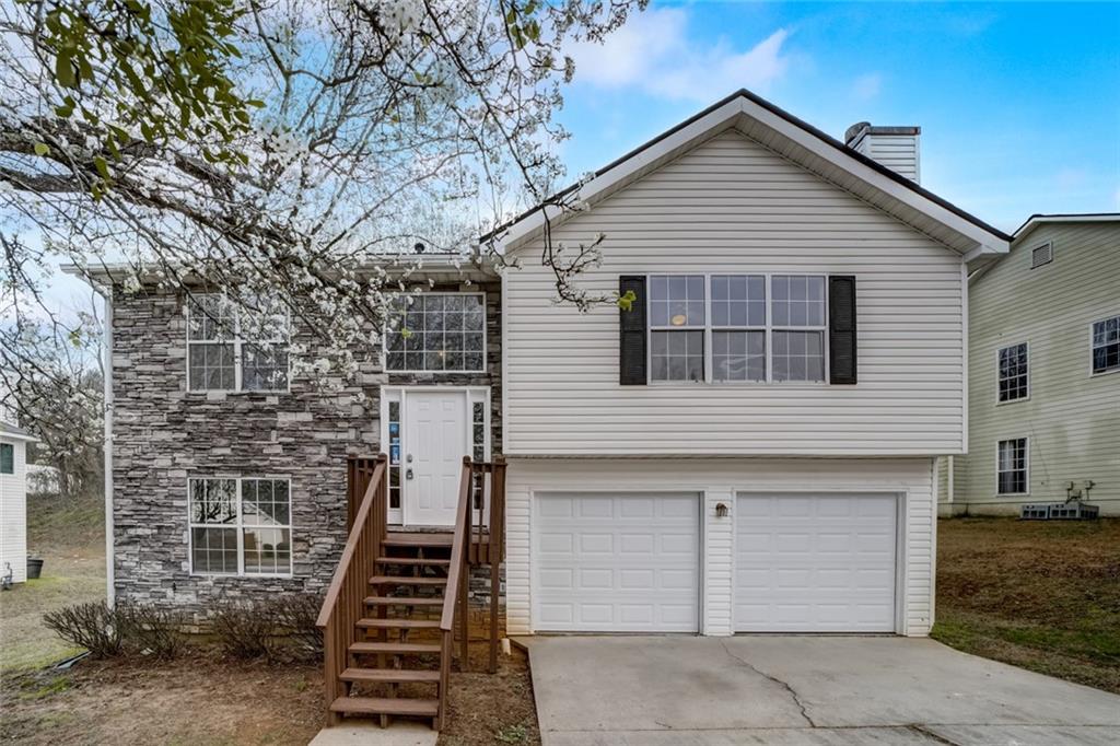 2180 Hidden Creek Drive Decatur, GA 30035 - Photo 1 of 1 a front view of a house with a garage