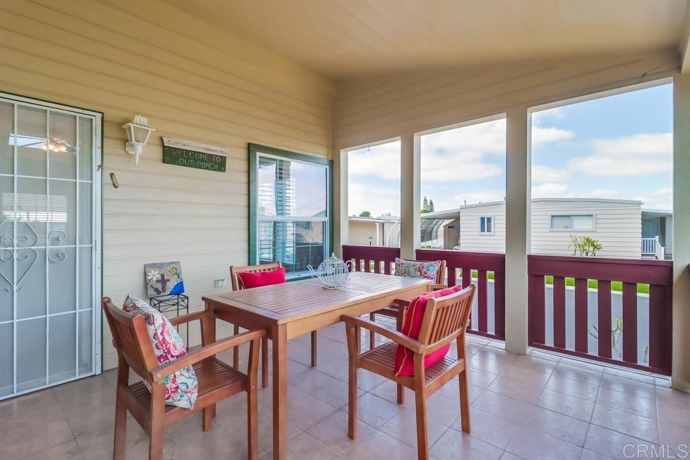 9500 Harritt Road, Unit 213 Lakeside, CA 92040 - Photo 11 of 25 a dining room with furniture and a floor to ceiling window
