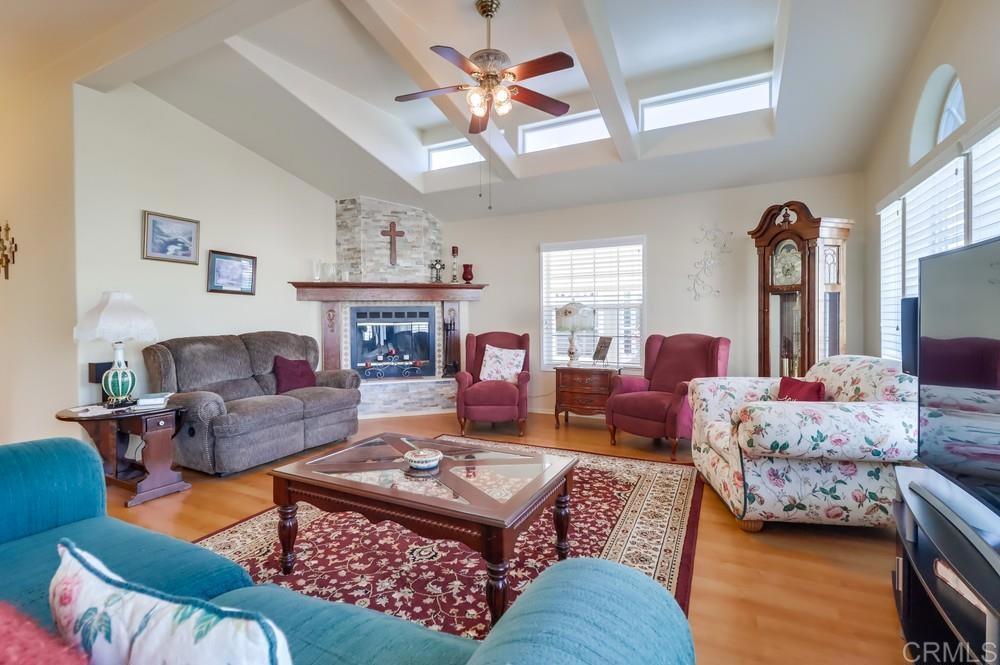 9500 Harritt Road, Unit 213 Lakeside, CA 92040 - Photo 14 of 25 a living room with furniture fireplace and a window