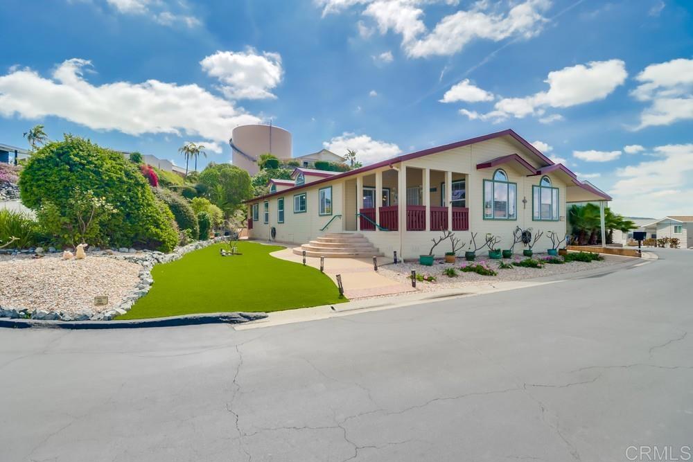 9500 Harritt Road, Unit 213 Lakeside, CA 92040 - Photo 2 of 25 a front view of house with yard and green space