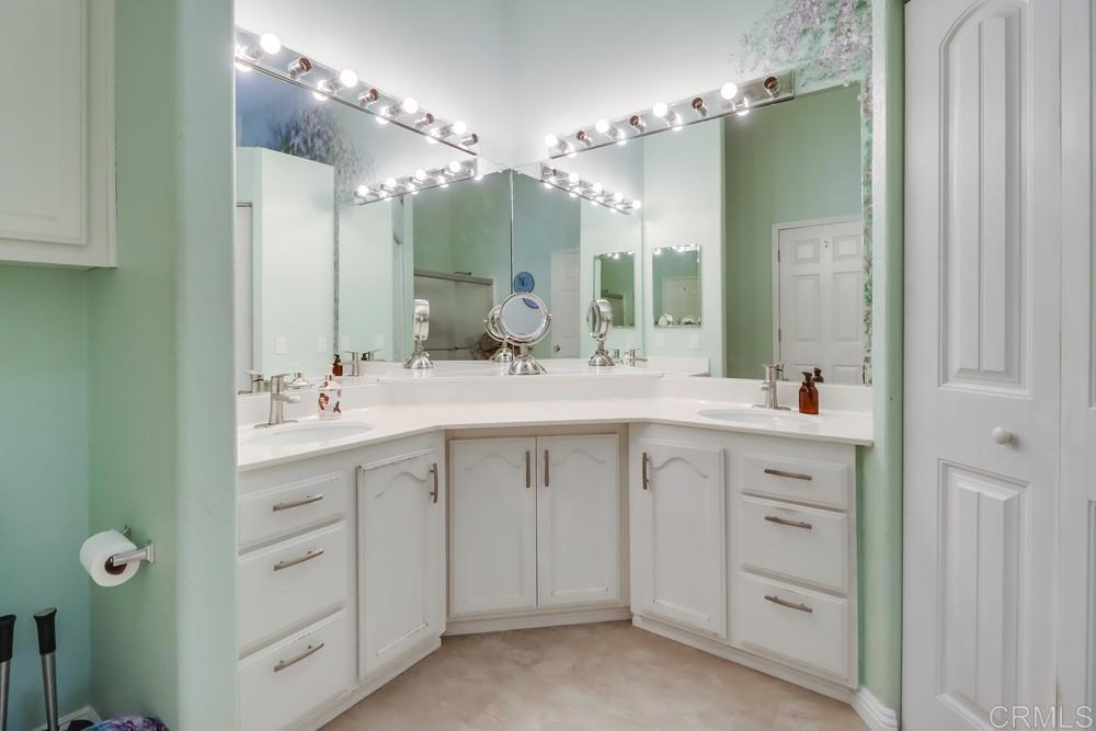 9500 Harritt Road, Unit 213 Lakeside, CA 92040 - Photo 21 of 25 a bathroom with a double vanity sink mirror and double