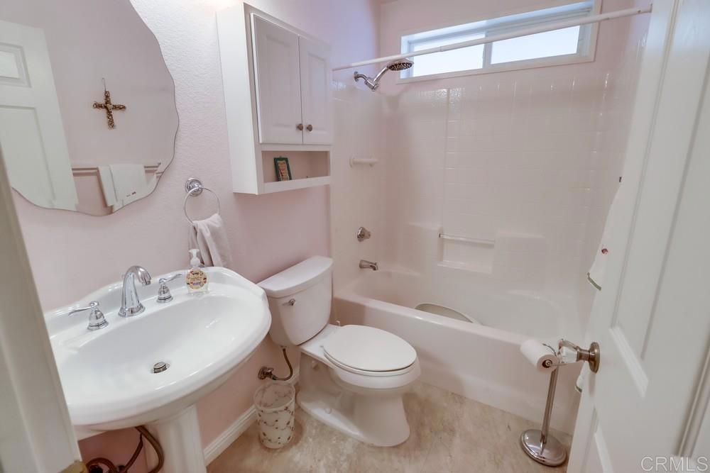 9500 Harritt Road, Unit 213 Lakeside, CA 92040 - Photo 23 of 25 a bathroom with a toilet sink and shower